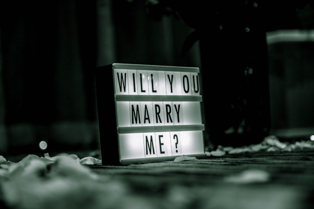 advertising sign with "Will You Marry Me" on it